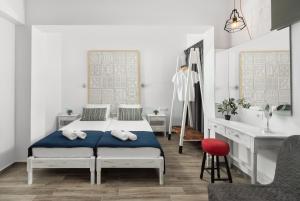 Postel nebo postele na pokoji v ubytování Pefkos View Suites & Maisonette