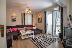 a living room with a couch and a table at Apartment Valerija in Jesenice