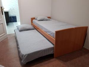 two beds sitting next to each other in a room at Malvarrosa Calle Pavia in Valencia