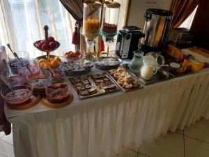 a buffet with many different types of food on a table at Hotel Diamond in Limenaria