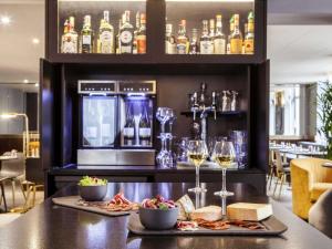 a bar with a lot of food on it at Mercure Nancy Centre Place Stanislas in Nancy