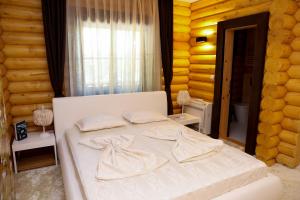 מיטה או מיטות בחדר ב-Deluxe House Glavatarski Han