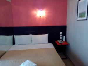 Posteľ alebo postele v izbe v ubytovaní Zappion Hotel