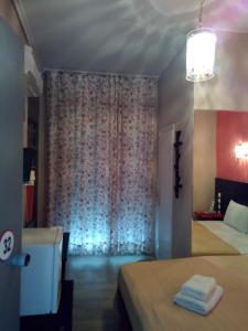 Posteľ alebo postele v izbe v ubytovaní Zappion Hotel