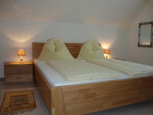 Postel nebo postele na pokoji v ubytování Ferienhaus Weingut Bauer