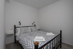 Postel nebo postele na pokoji v ubytování Apartments Siblings