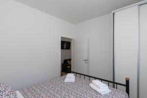 Postel nebo postele na pokoji v ubytování Apartments Siblings