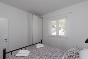 Postel nebo postele na pokoji v ubytování Apartments Siblings