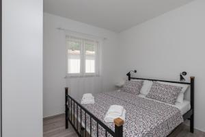Postel nebo postele na pokoji v ubytování Apartments Siblings