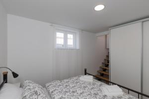 Postel nebo postele na pokoji v ubytování Apartments Siblings