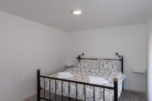 Postel nebo postele na pokoji v ubytování Apartments Siblings