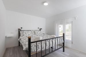 Postel nebo postele na pokoji v ubytování Apartments Siblings