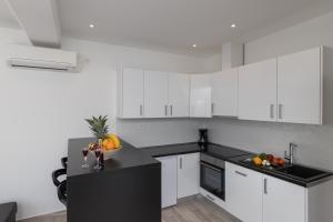 Kuchyň nebo kuchyňský kout v ubytování Apartments Siblings