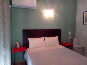 Posteľ alebo postele v izbe v ubytovaní Zappion Hotel