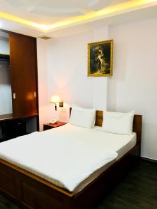 Ліжко або ліжка в номері QUEEN VICTORIA Hotel