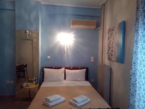 Posteľ alebo postele v izbe v ubytovaní Zappion Hotel