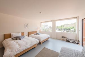 Ένα ή περισσότερα κρεβάτια σε δωμάτιο στο Fujino Kirameki Fujigotemba