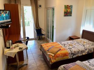 Krevet ili kreveti u jedinici u okviru objekta Axenia Hotel