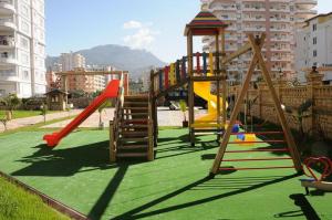 a playground with a slide and a slideintend at Yenisey Residence 2 in Mahmutlar