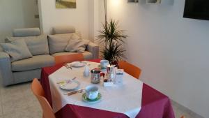a room with a table with a table cloth on it at Cabà Holiday Bardolino Gritti in Bardolino