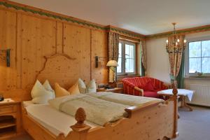 En eller flere senge i et værelse på Gästehaus - Apart Braito
