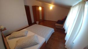 Łóżko lub łóżka w pokoju w obiekcie Guest House Ilic