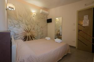 Postel nebo postele na pokoji v ubytování B&B Nacorè