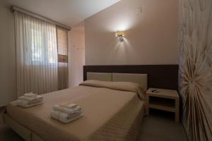 Postel nebo postele na pokoji v ubytování B&B Nacorè