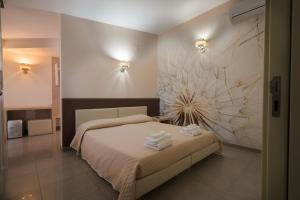 Postel nebo postele na pokoji v ubytování B&B Nacorè