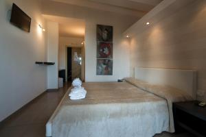 Postel nebo postele na pokoji v ubytování B&B Nacorè