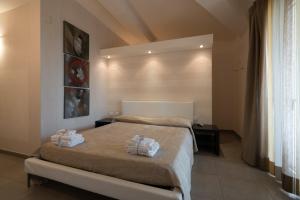 Postel nebo postele na pokoji v ubytování B&B Nacorè