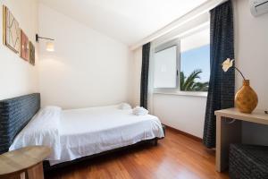 Postel nebo postele na pokoji v ubytování B&B Nacorè