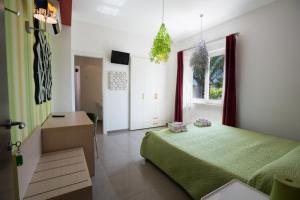 Postel nebo postele na pokoji v ubytování B&B Nacorè