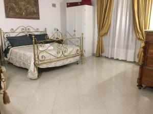 Postel nebo postele na pokoji v ubytování Gianmaria B&B