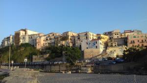 a group of buildings on top of a hill at Il Corvino in Diamante