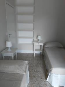 Tempat tidur dalam kamar di Via Stazione 5