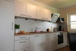 Kuchyň nebo kuchyňský kout v ubytování Alpenflair Ferienwohnungen Whg 305 + 8 fotografií