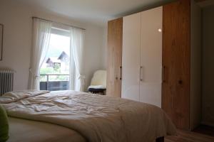 Postel nebo postele na pokoji v ubytování Alpenflair Ferienwohnungen Whg 305