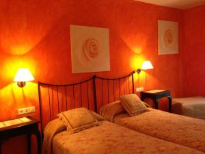 A bed or beds in a room at Hotel Sierra Quilama
