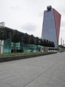 a tall building in front of a plaza at Best Western Plus Net Tower Hotel Padova in Padova