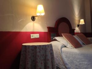 A bed or beds in a room at Hotel Sierra Quilama
