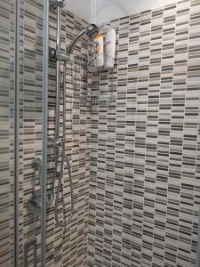 a bathroom with a shower with a shower curtain at Villa Sabbiadoro in Noto Marina