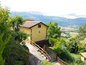 a house on a hill with a view at Casa Bellavista in Viggianello