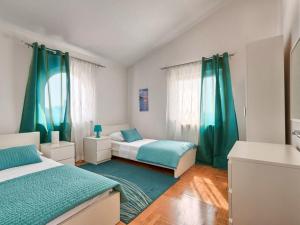 Posteľ alebo postele v izbe v ubytovaní Villa Carmen