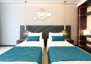 Voodi või voodid majutusasutuse The Hive Hotel toas