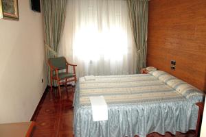 Postel nebo postele na pokoji v ubytování Hostal Castilla