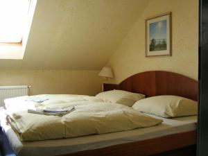 Ένα ή περισσότερα κρεβάτια σε δωμάτιο στο Hotel Goethe