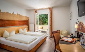 Voodi või voodid majutusasutuse Hotel Spitzberg Garni toas