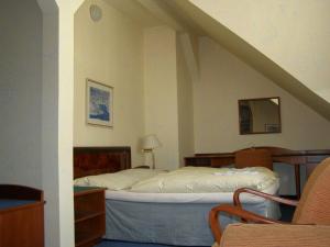 Ένα ή περισσότερα κρεβάτια σε δωμάτιο στο Hotel Goethe