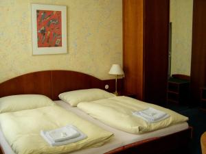 Ένα ή περισσότερα κρεβάτια σε δωμάτιο στο Hotel Goethe